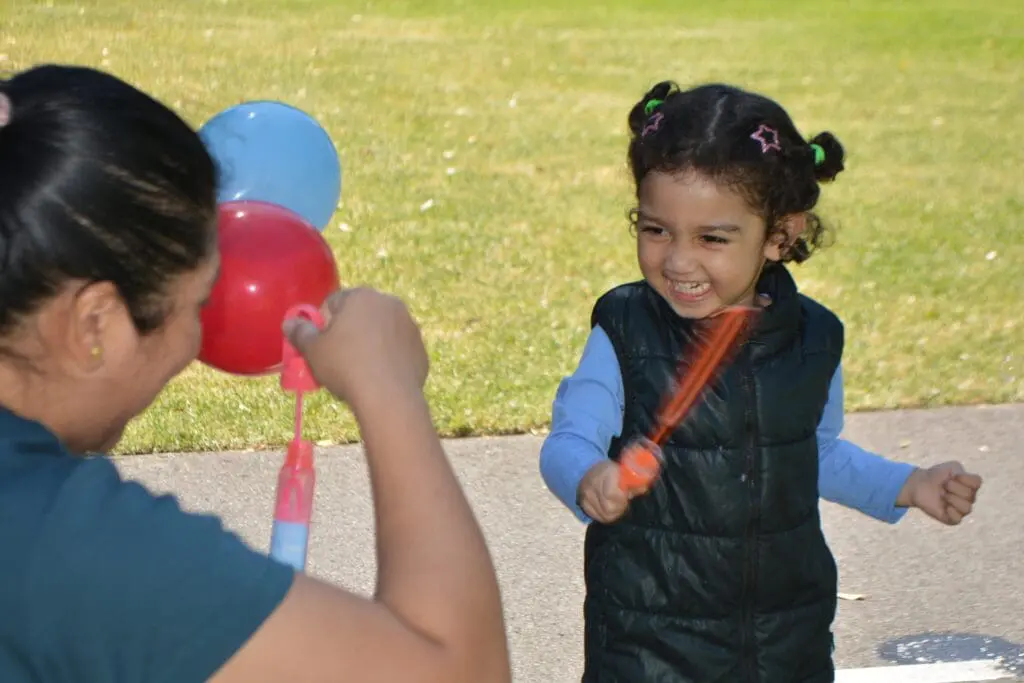 excited child with bubbles